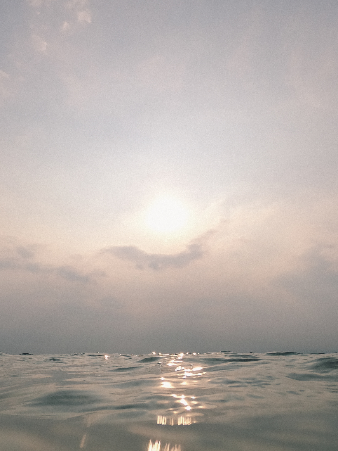 Sunlight in Sky and Calm Sea